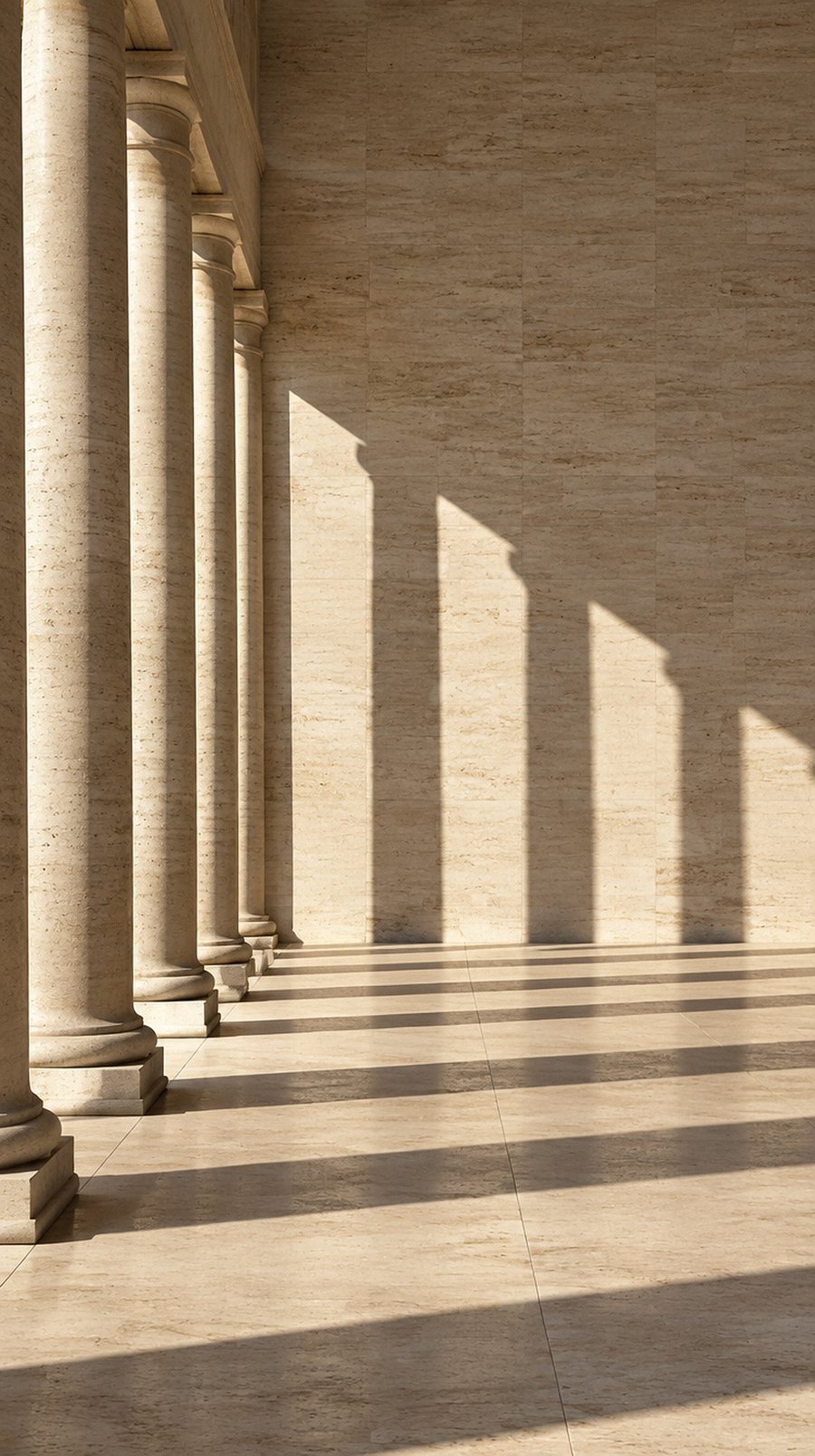 Late sun on a travertine colonnade