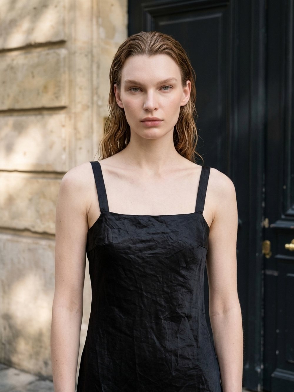 Close on the crinkled satin and square neckline